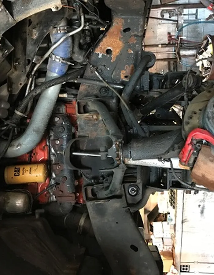 Worn strut and spring before replacement