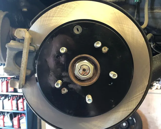 Fresh brake rotor fitted on the hub
