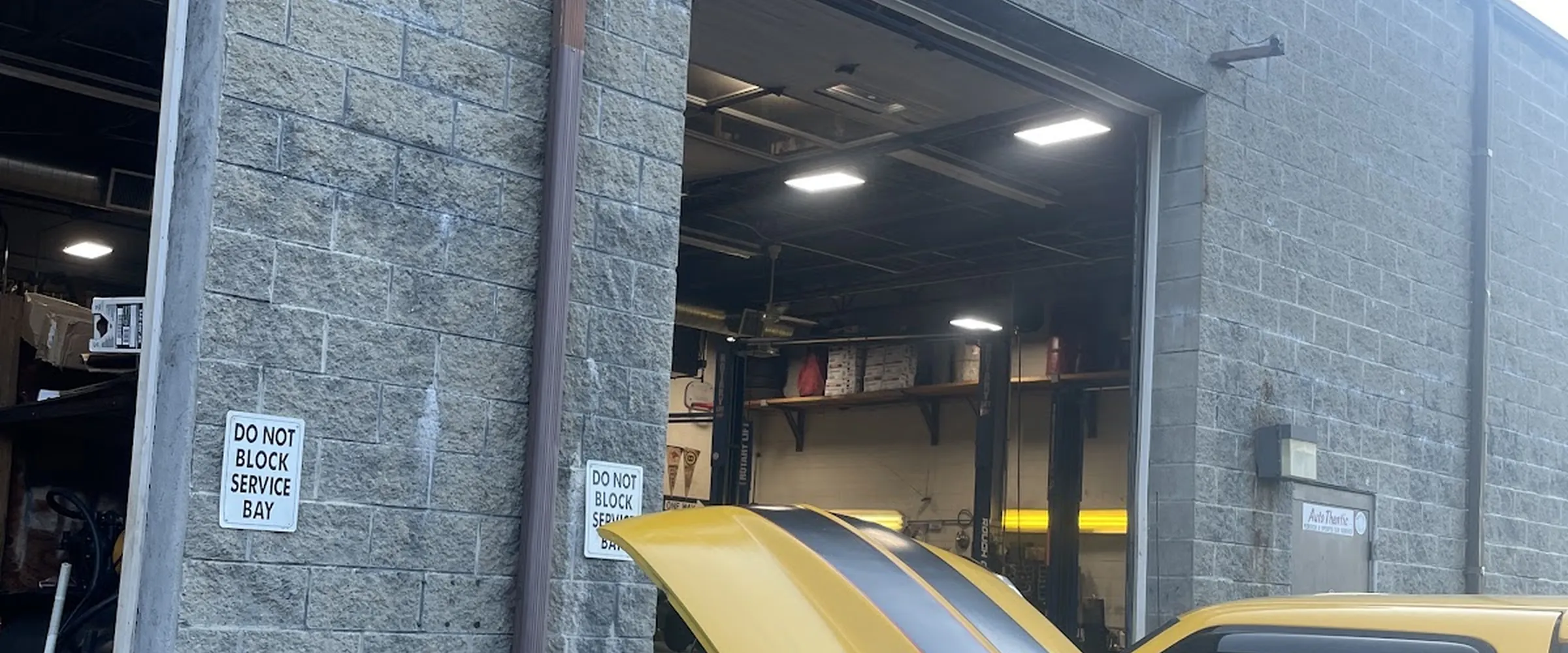 Yellow Chevy S10 outside the AC Auto shop