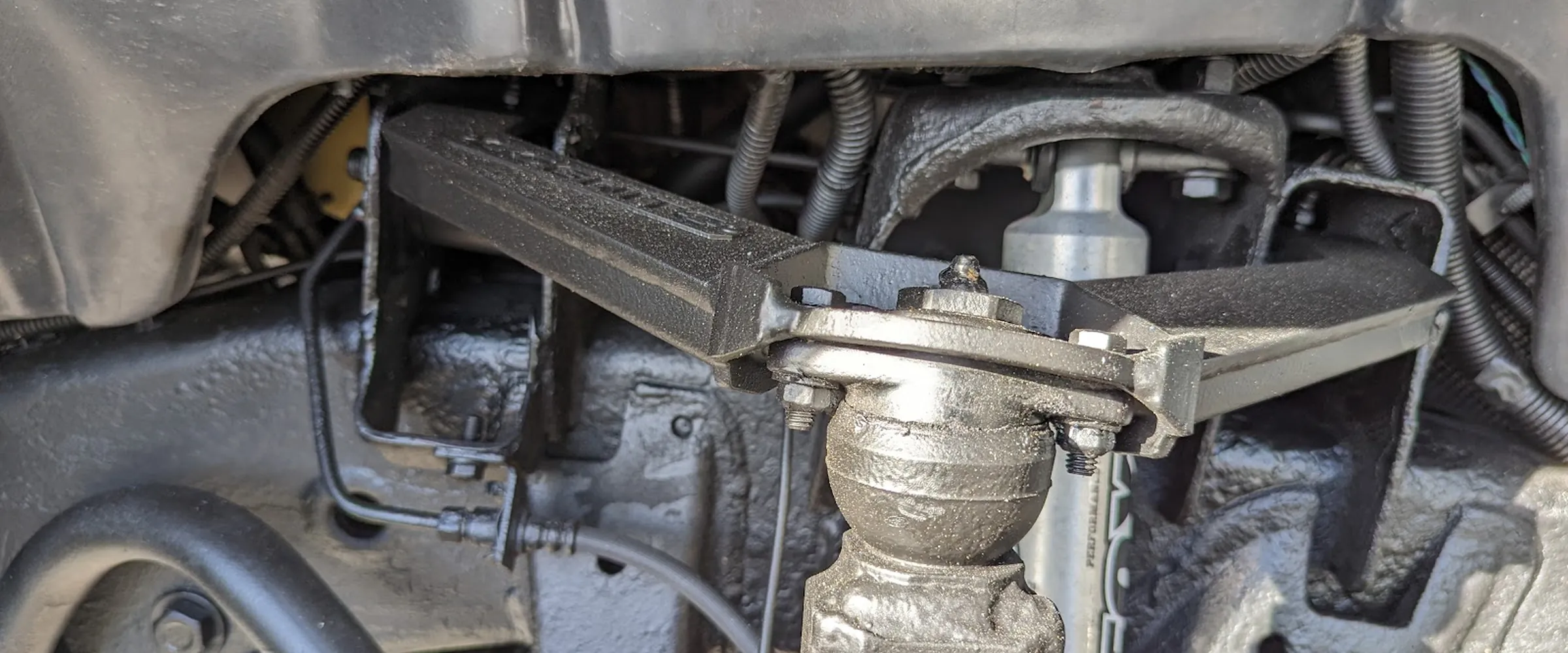 Fresh rust-prevention undercoating on a truck